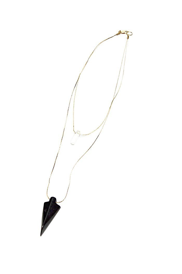 gold chain layered necklace with crystal pendant and black arrowhead pendant by Ace Commune